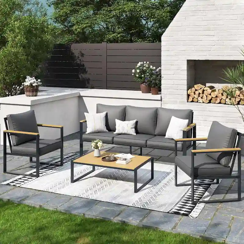 Ensemble de canapés de jardin moderne 4 pièces – Structure en fer avec coussins gris et table basse aspect bois