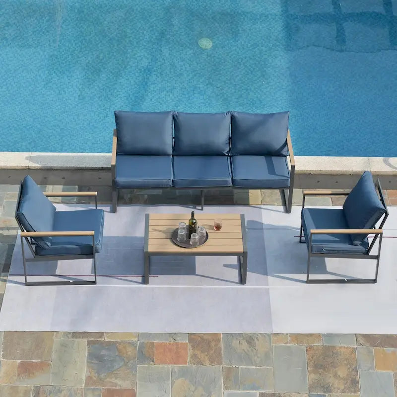 Ensemble de canapés de jardin moderne 4 pièces – Structure en fer avec coussins gris et table basse aspect bois